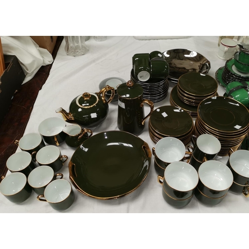 280 - A large quantity of gold lustre and dark green  tea and coffee ware and similar silver lustre ware, ... 