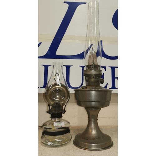 480 - A nickel plated oil lamp; a wall hanging oil lamp with glass reservoir