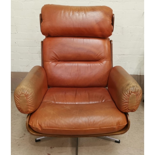 537 - After Herman Miller Eames, a mid 20th century swivel arm chair, with teak venered support on chrome ... 