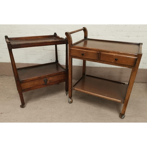609 - An early 20th century oak tea trolley; and another