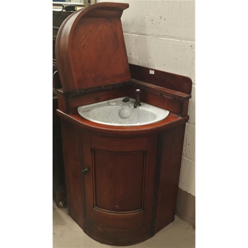 616 - A Victorian pitch pine case corner unit fitted with a ceramic washbasin, hinged lid and door, depth ... 
