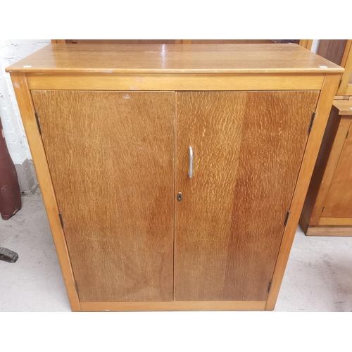 634 - A mid 20th century light oak double cupboard, Height 42