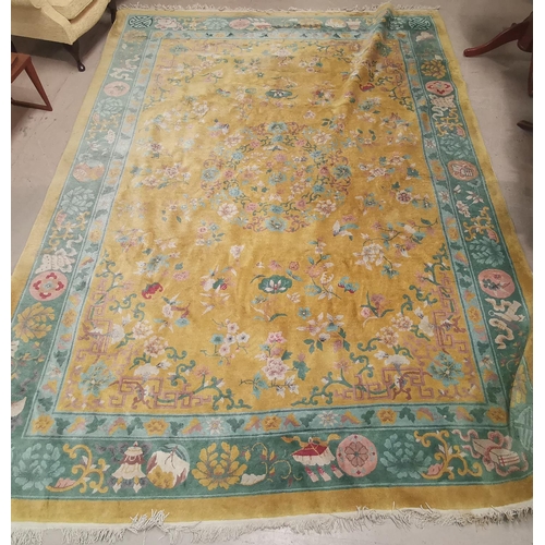 639 - A large Chinese yellow ground carpet, 140