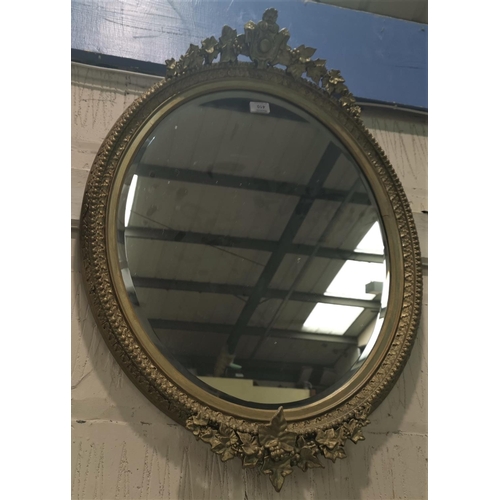 647 - An oval gilt framed mirror