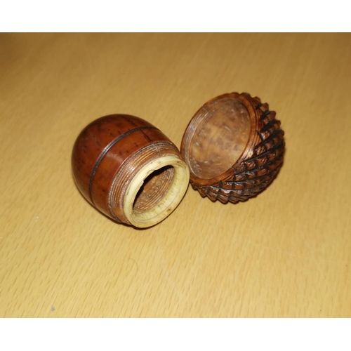 289 - A 19th century carved wood novelty nutmeg grater in the form of an acorn with screw off top, (grater... 