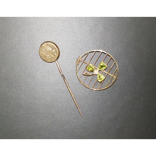 292 - A circular gold brooch set cloverleaf; a stick pin