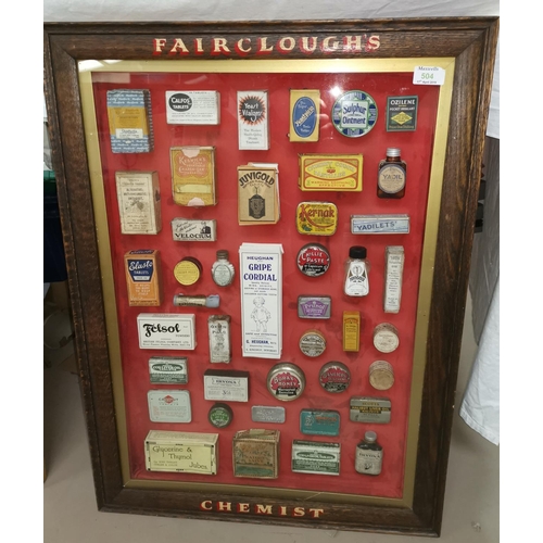 504 - An oak framed display case of vintage chemsit packets, frame lettered 'Fairclough's Chemist'