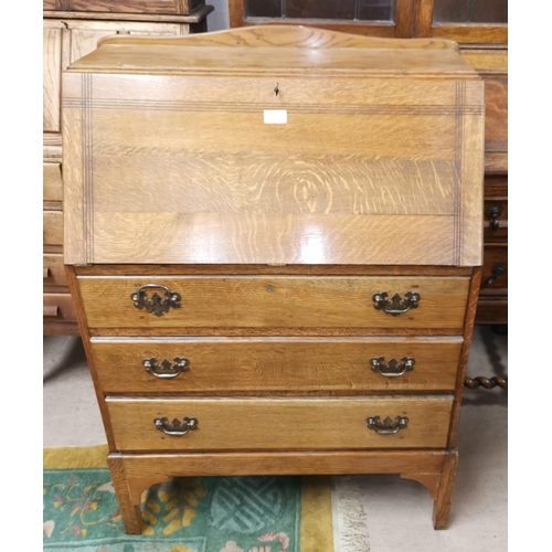 534 - An early 20th century oak fall front bureau with 3 drawers below