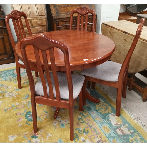 559 - A modern stained wood dining suite comprising circular pedestal table and 4 chairs