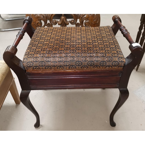 587 - An Edwardian mahogany piano stool on cabriole legs with turned handles and hinged lid