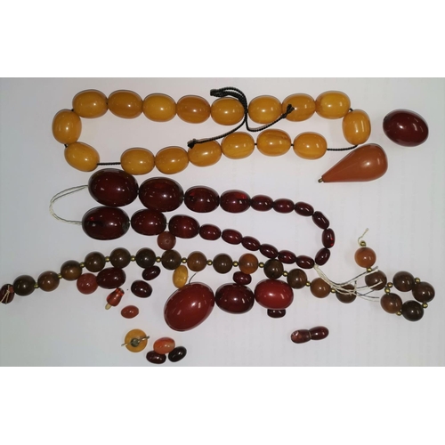 298 - A quantity of amber coloured beads