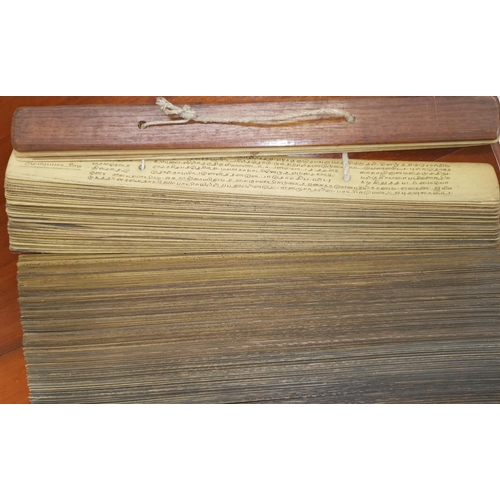 505 - A Buddhist text written on palm leaf with connecting sections
