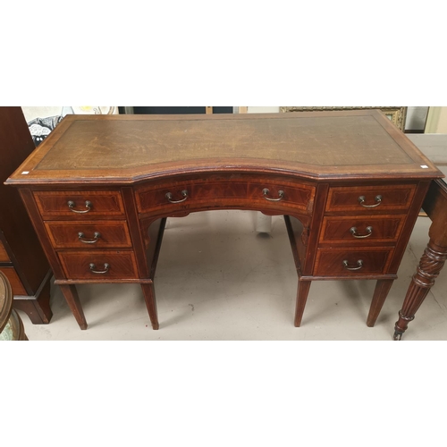 548 - An Edwardian inlaid and crossbanded satinwood kneehole desk in the Sheraton style with inset leather... 