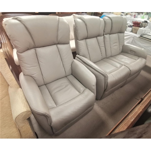 566 - A modern 2 piece lounge suite in fawn hide comprising 2 seater reclining settee and matching armchai... 