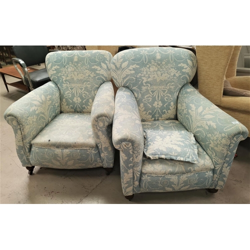 580 - A pair of Edwardian arm chairs upholstered in traditional blue fabric