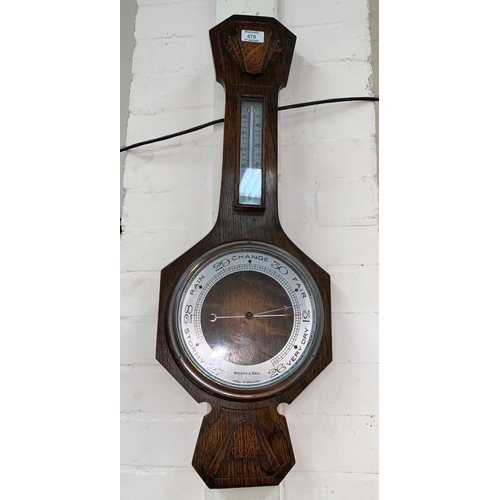 478 - A 1930's oak cased aneroid barometer by Walker & Hall