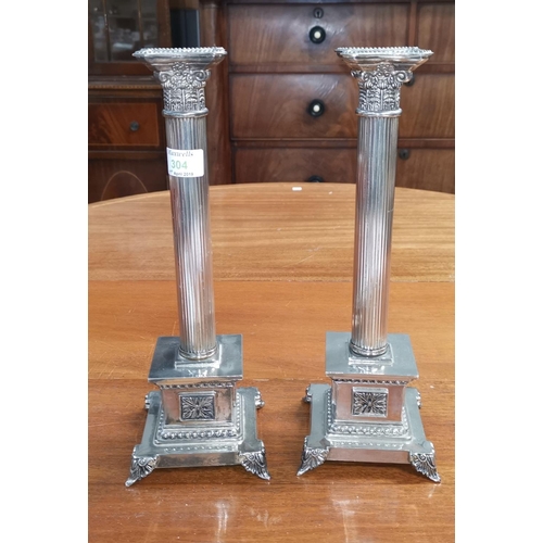 304 - A pair of Corinthian column candlesticks, classical reeded design, on stepped square bases, height 1... 