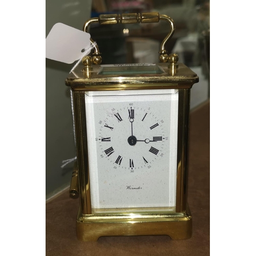 444 - A modern brass carriage clock by Worcester