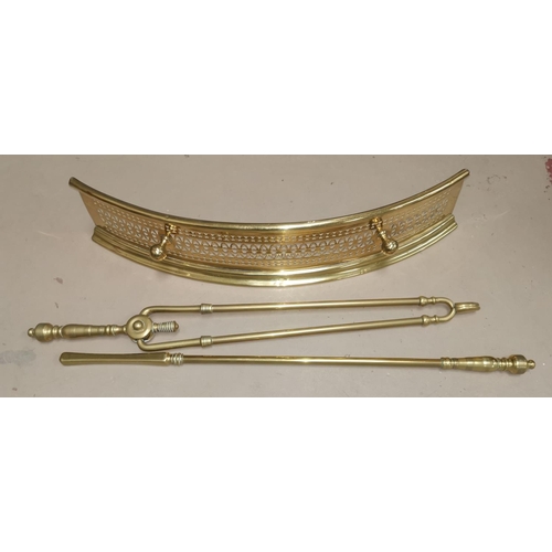463 - A brass fender and 2 piece companion set