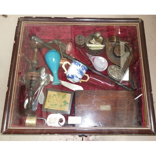 496 - A display case with collectables including mauchlinware box, oriental items, silver sugar tongs, ebo... 
