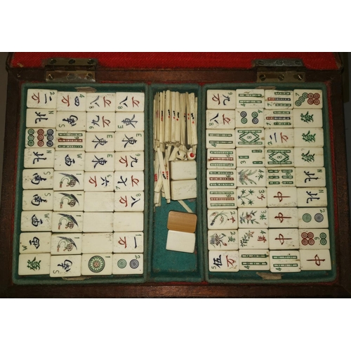 508 - A bone and bamboo Mahjong set; a quantity of coloured clay and glass marbles