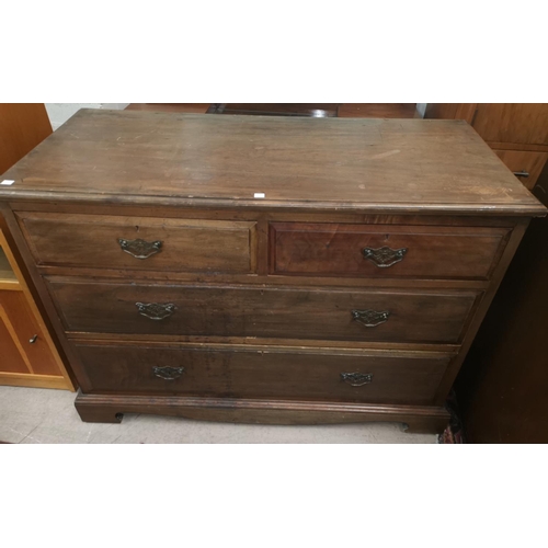 542 - An Edwardian walnut chest of 2 long and 2 short drawers