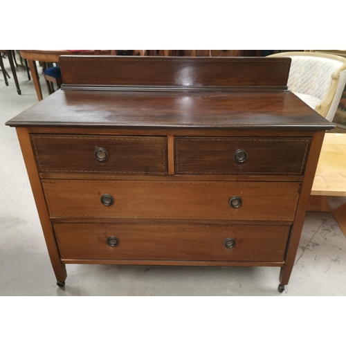 582 - An Edwardian inlaid mahogany dressing table and chest of drawers
