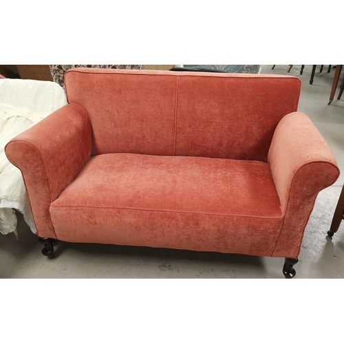 585 - An early 20th century 2 seater drop end settee in rust velvet upholstery