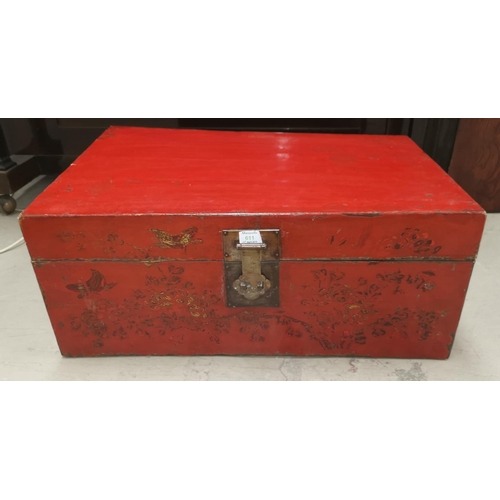 611 - A Chinese red lacquer chest/blanket box with brass bindings