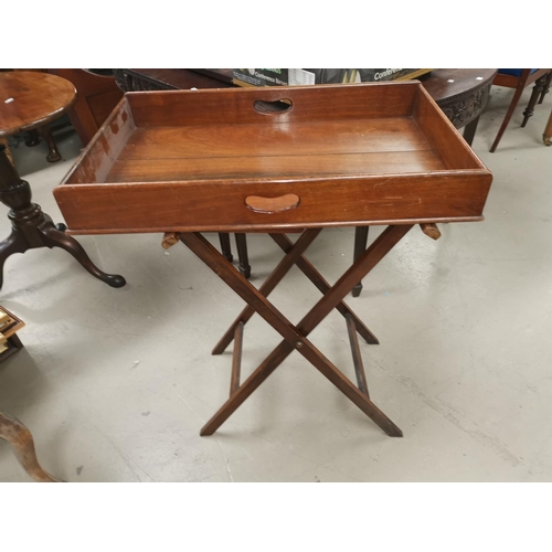 612 - An Edwardian mahogany butlers tray and stand