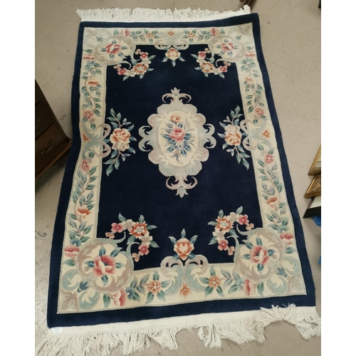 615 - A Chinese rug with floral pattern on blue ground