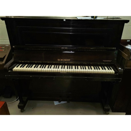 640 - A mahogany cased Shubert upright piano