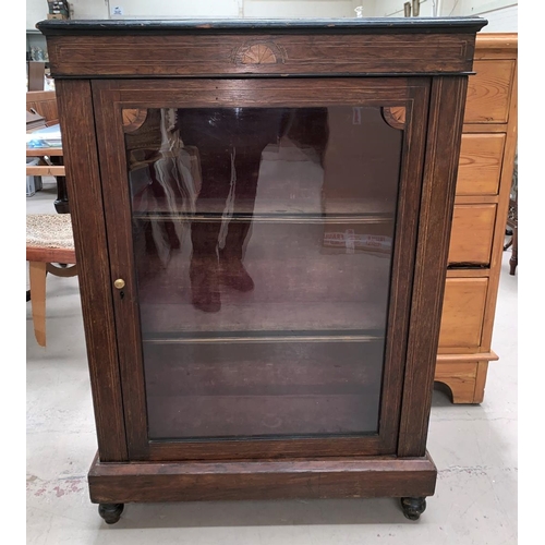 626 - A Victorian rosewood display cabinet with inlaid decoration enclosed by single glazed door