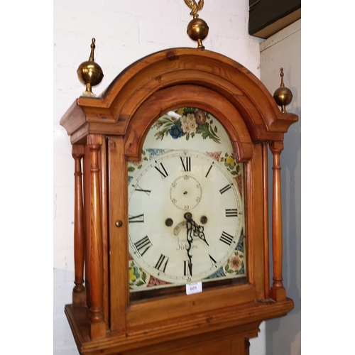 590 - A 19th Century longcase clock, arch top hood with turned pillars and brass finials, quarter reeded c... 