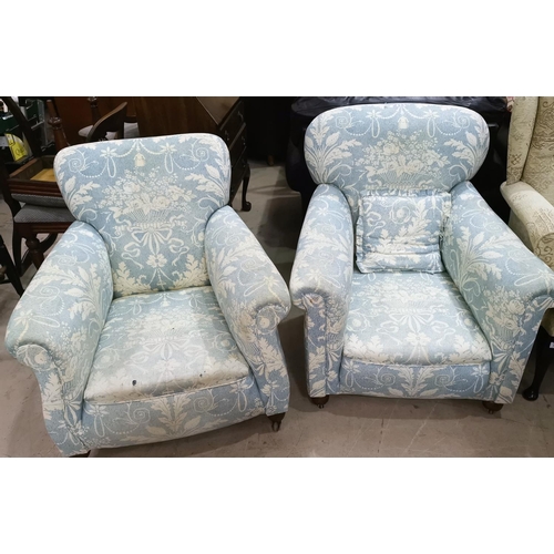 567 - A pair of Edwardian arm chairs upholstered in traditional blue fabric