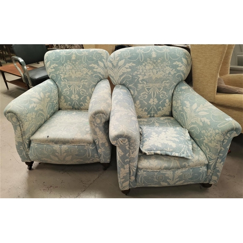 567 - A pair of Edwardian arm chairs upholstered in traditional blue fabric