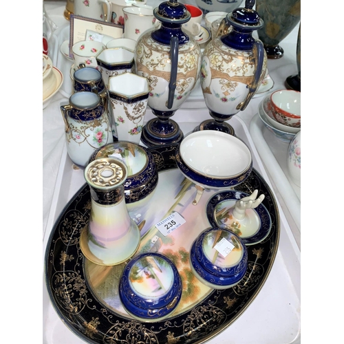 235 - A collection of Noritake blue and gilt china with polychrome floral panels comprising 7 piece trinke... 