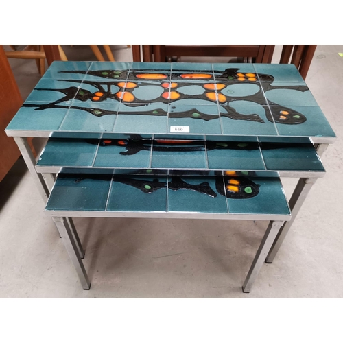 559 - A 1970's nest of 3 chrome coffee tables, inset tile tops