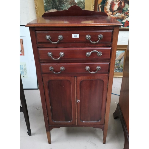 563 - An Edwardian mahogany music cabinet with 3 drawers and cupboard; an Edwardian inlaid chair