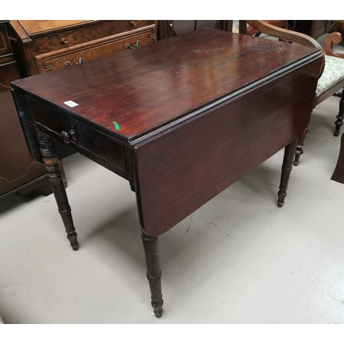 566 - An early 19th century mahogany Pembroke table with frieze drawer, on turned legs