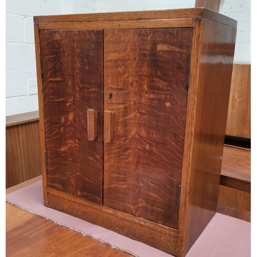 575 - A 1960's walnut trolley/table; a small oak side cabinet