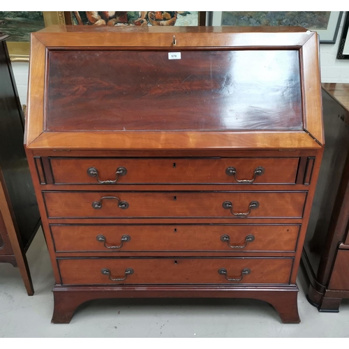 578 - A mahogany reproduction fall front bureau with fitted interior and 4 drawers, on bracket feet