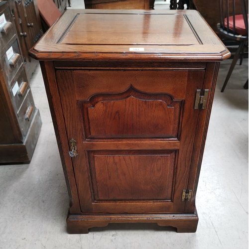 587 - A period style distressed oak stereo cabinet, enclosed by fielded panel door, handmade by Cumpers of... 