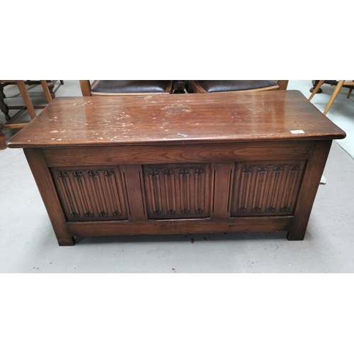 604 - An oak Jacobean style blanket chest with linenfold carving to 3 front panels, 42