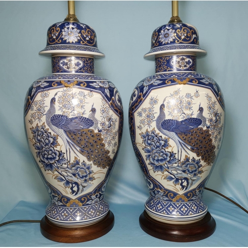 175 - A pair of oriental blue and white lamp bases 24
