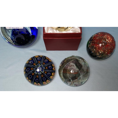177 - Five paperweights: Bacarat style millefiori weight, modern weight etched with dolphins and 3 others