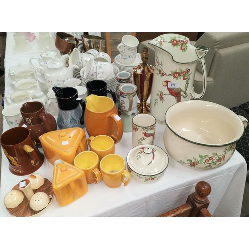 277 - A Royal Doulton part toilet set decorated with macaws; a pair of Langley stoneware vases; a Carlton ... 