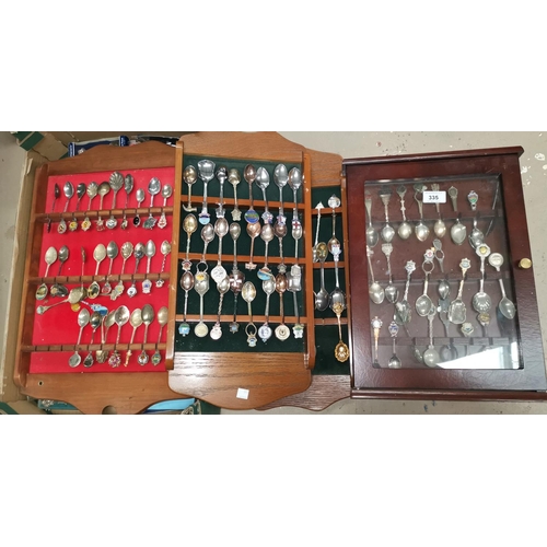 335 - A collection of silver spoons, loose and on wall shelves