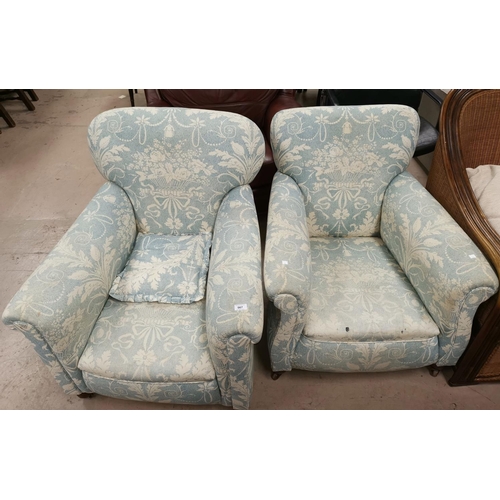 567 - A pair of Edwardian arm chairs upholstered in traditional blue fabric