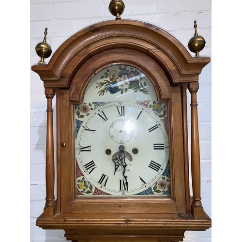 590 - A 19th Century longcase clock, arch top hood with turned pillars and brass finials, quarter reeded c... 